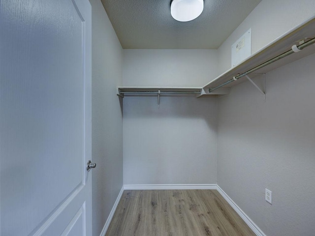 6709 Doyal Dr, Austin, TX 78747 - spacious closet with wood finished floors