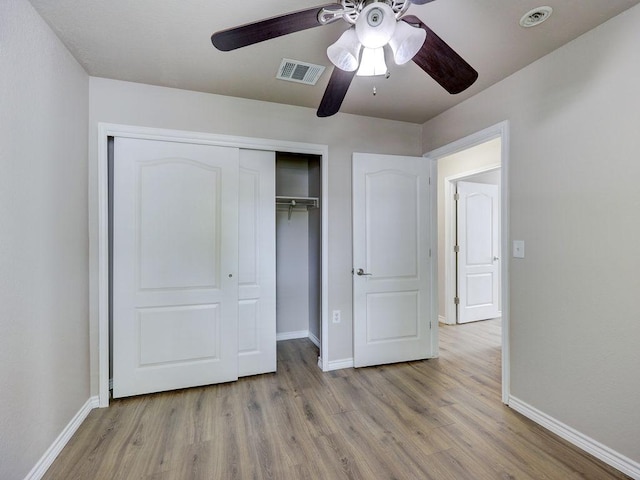 6709 Doyal Dr, Austin, TX 78747 - unfurnished bedroom featuring baseboards, wood finished floors, and a closet