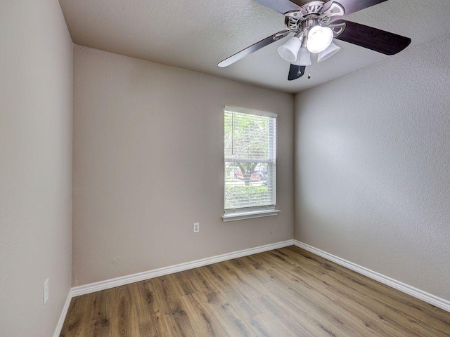 6709 Doyal Dr, Austin, TX 78747 - unfurnished room featuring light wood-style flooring, baseboards, and ceiling fan