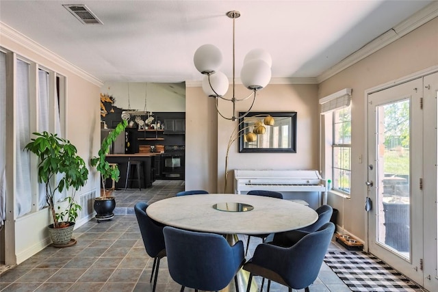 358 Easley Rd, Smithville, TX 78957 - tiled dining space with ornamental molding and a chandelier