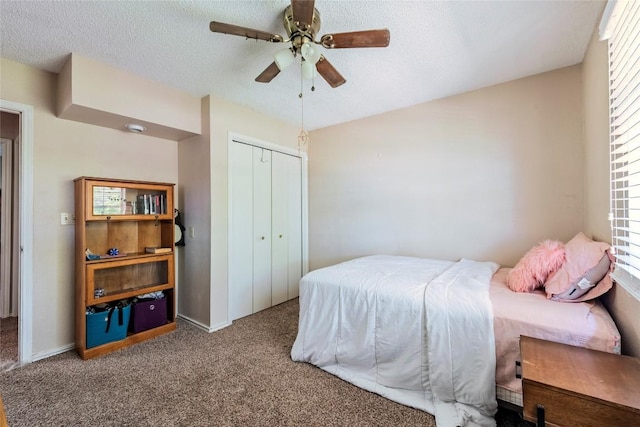 358 Easley Rd, Smithville, TX 78957 - bedroom with a textured ceiling, carpet, a closet, and multiple windows