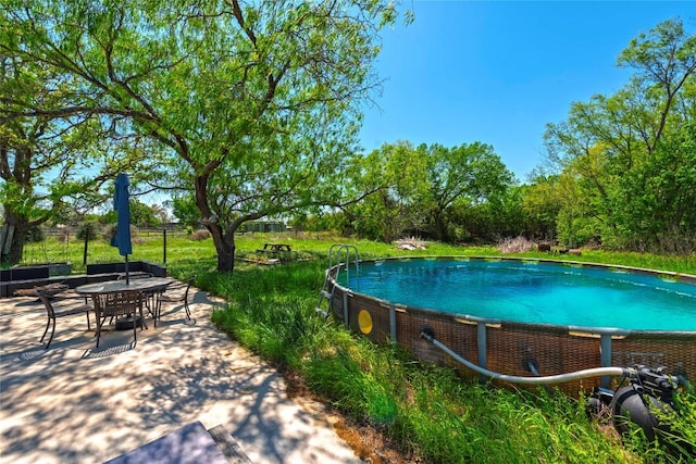 358 Easley Rd, Smithville, TX 78957 - outdoor pool featuring a patio area and outdoor dining area