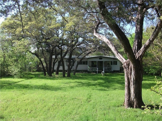 18201 Gregg Bluff Rd, Jonestown, TX 78645 - view of grassy yard with covered porch