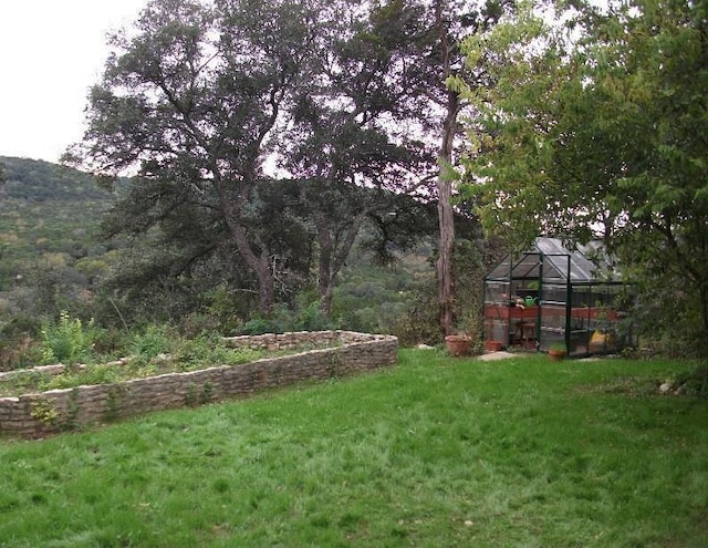 view of yard with an outbuilding and an exterior structure