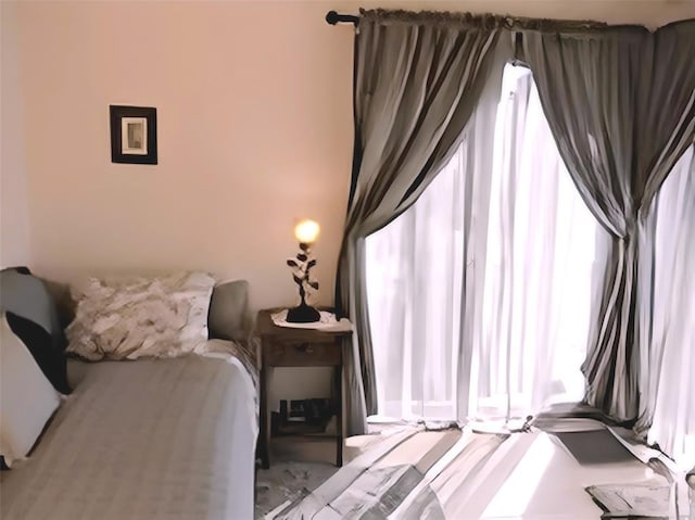 bedroom featuring multiple windows