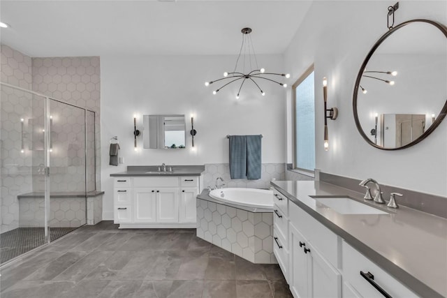 2616 War Wagon Way, Leander, TX 78641 - full bath with a stall shower, two vanities, a bath, and a chandelier