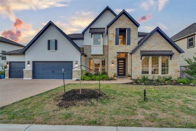 2616 War Wagon Way, Leander, TX 78641 - view of front of home featuring stone siding, stucco siding, concrete driveway, and a front yard