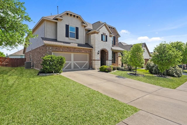 5679 Corsica Loop, Round Rock, TX 78665 - view of front of house featuring driveway, a garage, brick siding, roof with shingles, and stucco siding