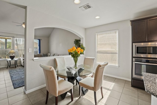 5679 Corsica Loop, Round Rock, TX 78665 - dining room with ceiling fan, light tile patterned flooring, arched walkways, and recessed lighting