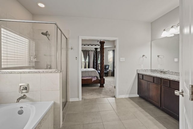 5679 Corsica Loop, Round Rock, TX 78665 - ensuite bathroom with a stall shower, vanity, a bath, and tile patterned floors