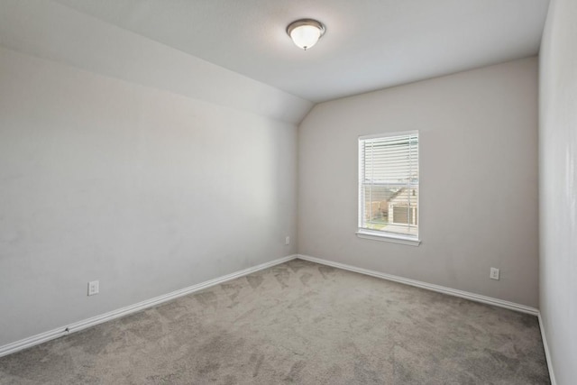 5679 Corsica Loop, Round Rock, TX 78665 - spare room featuring carpet floors and vaulted ceiling