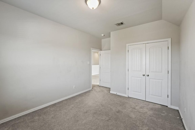 5679 Corsica Loop, Round Rock, TX 78665 - unfurnished bedroom featuring carpet, a closet, and lofted ceiling
