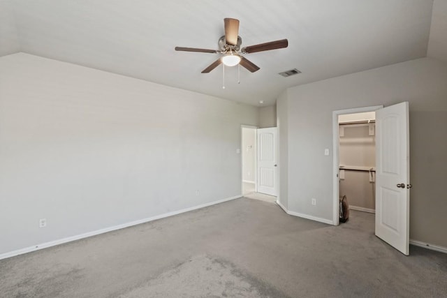5679 Corsica Loop, Round Rock, TX 78665 - unfurnished bedroom with carpet floors, vaulted ceiling, a walk in closet, ceiling fan, and a closet
