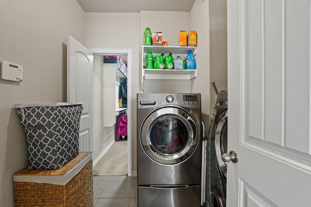 5679 Corsica Loop, Round Rock, TX 78665 - washroom with washer and dryer, tile patterned floors, and carpet floors
