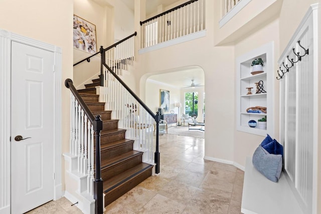 10012 Scull Creek Dr, Austin, TX 78730 - foyer entrance with a high ceiling, ceiling fan, stairway, and baseboards