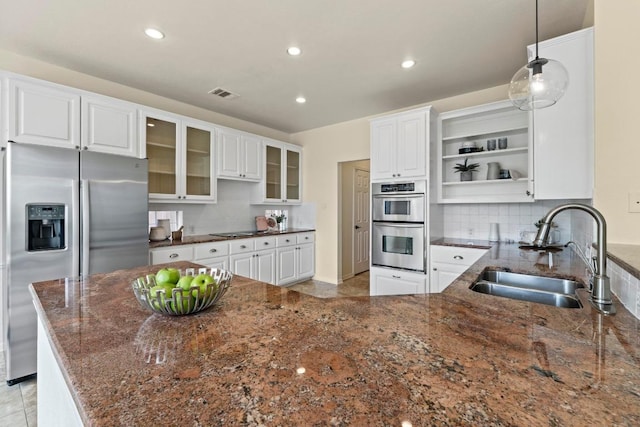 10012 Scull Creek Dr, Austin, TX 78730 - kitchen featuring stainless steel appliances, open shelves, tasteful backsplash, white cabinetry, and recessed lighting