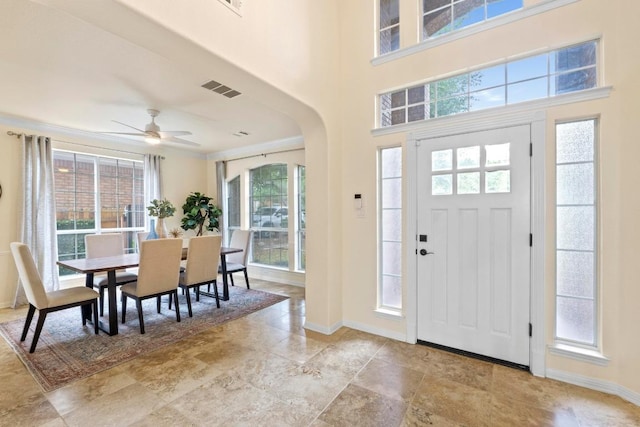 10012 Scull Creek Dr, Austin, TX 78730 - entryway with healthy amount of natural light, arched walkways, and a ceiling fan