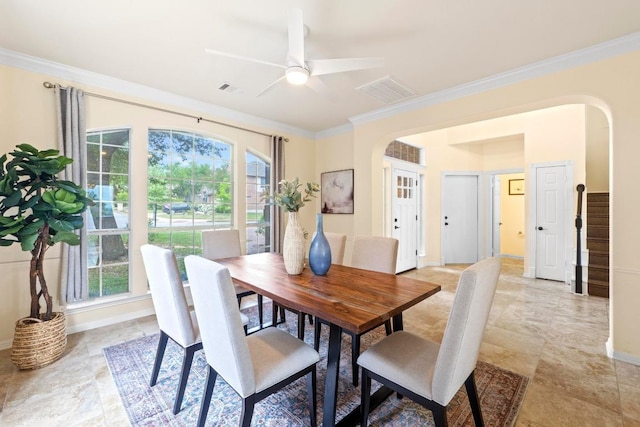 10012 Scull Creek Dr, Austin, TX 78730 - dining room featuring arched walkways, ornamental molding, a ceiling fan, and baseboards