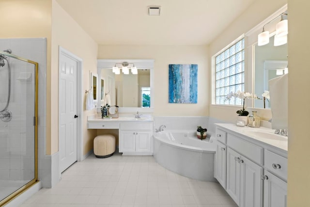 10012 Scull Creek Dr, Austin, TX 78730 - full bath with a stall shower, a garden tub, and two vanities