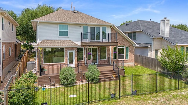 10012 Scull Creek Dr, Austin, TX 78730 - rear view of house with a balcony, brick siding, cooling unit, and a shingled roof