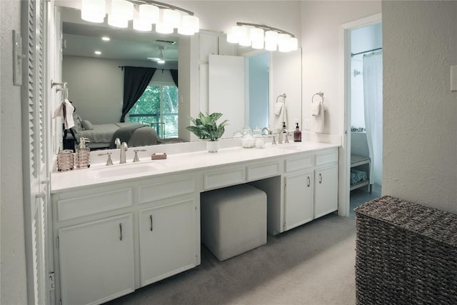 1908 Trevino Dr, Austin, TX 78746 - ensuite bathroom with double vanity and a textured wall