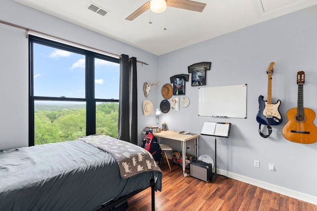 45 Saddle Rock Rdg, Wimberley, TX 78676 - bedroom featuring wood finished floors, visible vents, a ceiling fan, and baseboards