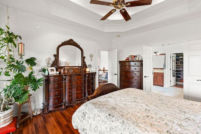 45 Saddle Rock Rdg, Wimberley, TX 78676 - bedroom with a raised ceiling, wood finished floors, crown molding, and ensuite bathroom