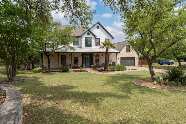 45 Saddle Rock Rdg, Wimberley, TX 78676 - view of front facade with stone siding, a front lawn, driveway, and covered porch