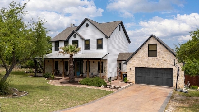 45 Saddle Rock Rdg, Wimberley, TX 78676 - view of front of property with stone siding, a front lawn, covered porch, and concrete driveway