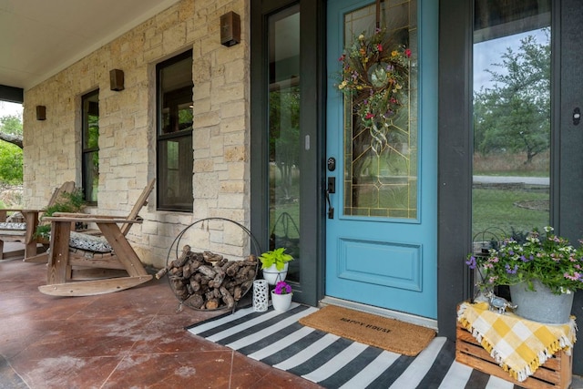45 Saddle Rock Rdg, Wimberley, TX 78676 - entrance to property with a porch and stone siding