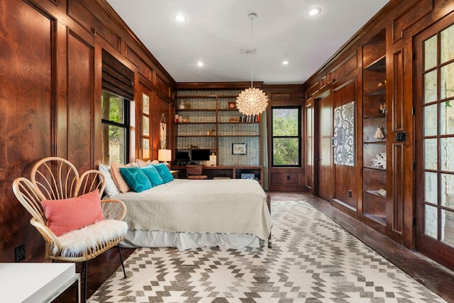45 Saddle Rock Rdg, Wimberley, TX 78676 - bedroom featuring crown molding, wood walls, recessed lighting, and multiple windows