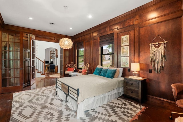 45 Saddle Rock Rdg, Wimberley, TX 78676 - bedroom with recessed lighting, visible vents, french doors, arched walkways, and crown molding