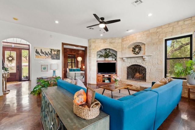 45 Saddle Rock Rdg, Wimberley, TX 78676 - tiled living area with a ceiling fan, visible vents, a wealth of natural light, and a fireplace