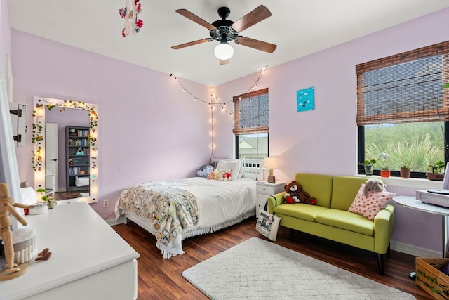 45 Saddle Rock Rdg, Wimberley, TX 78676 - bedroom featuring wood finished floors, ceiling fan, and multiple windows