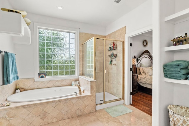 45 Saddle Rock Rdg, Wimberley, TX 78676 - ensuite bathroom featuring a garden tub, visible vents, connected bathroom, and a shower stall