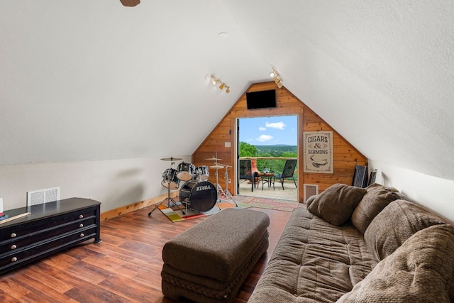 45 Saddle Rock Rdg, Wimberley, TX 78676 - living room with lofted ceiling, baseboards, wood finished floors, and wood walls