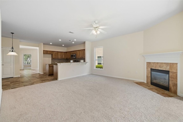 504 Deer Meadow Cir, Georgetown, TX 78633 - unfurnished living room featuring light carpet, ceiling fan, a fireplace, baseboards, and recessed lighting