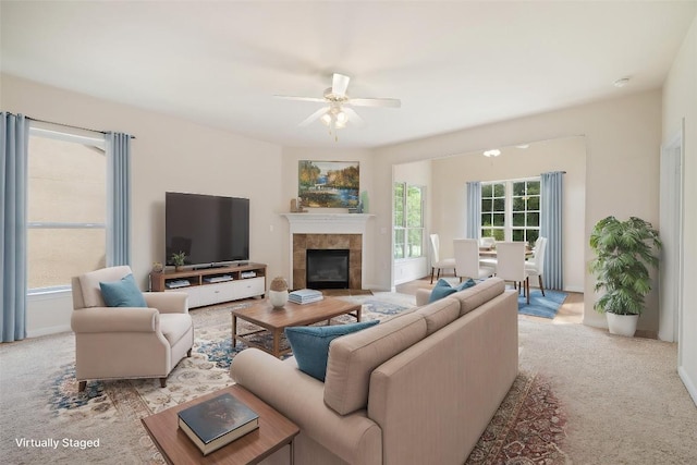504 Deer Meadow Cir, Georgetown, TX 78633 - living room featuring ceiling fan, light carpet, and a tiled fireplace