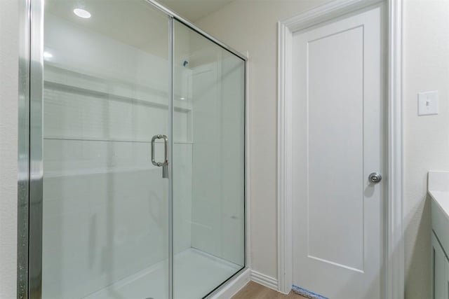 3020 Titus Ct, Temple, TX 76501 - full bathroom with a stall shower, vanity, and wood finished floors