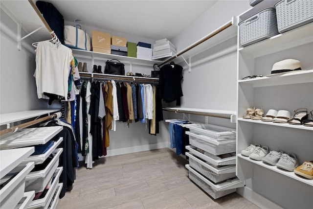 spacious closet with wood finished floors