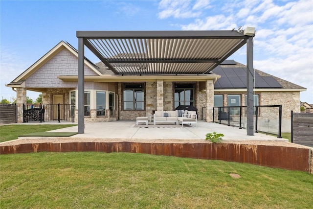 rear view of property featuring an outdoor living space, a lawn, and a patio