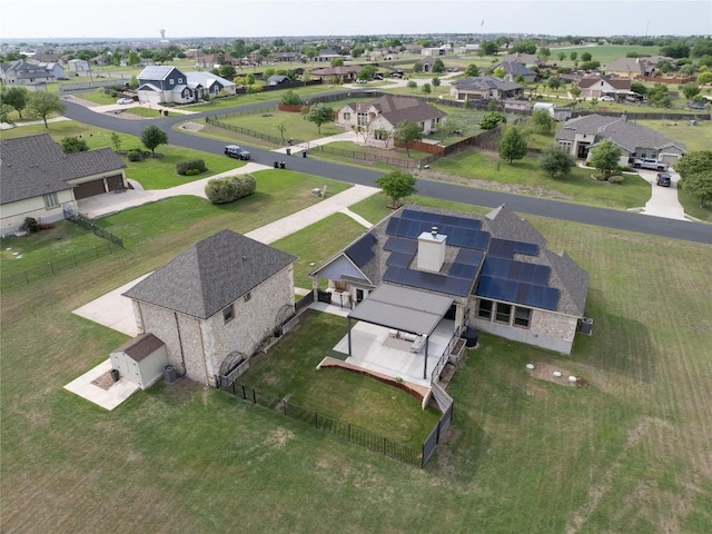 birds eye view of property with a residential view