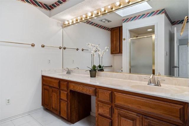21407 High Dr, Lago Vista, TX 78645 - bathroom featuring double vanity, tile patterned flooring, and a shower stall