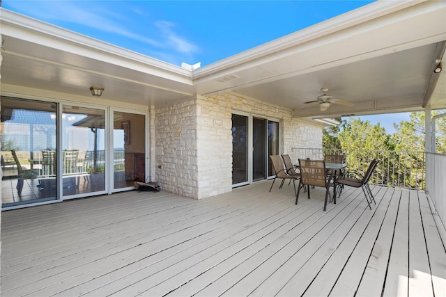 21407 High Dr, Lago Vista, TX 78645 - wooden deck with outdoor dining area and a ceiling fan