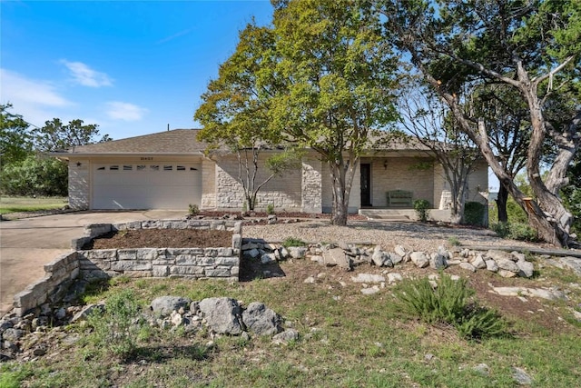 21407 High Dr, Lago Vista, TX 78645 - view of front of property with an attached garage, concrete driveway, and brick siding