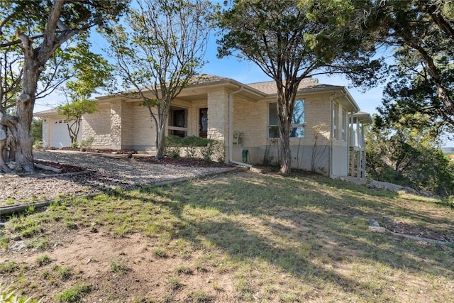 21407 High Dr, Lago Vista, TX 78645 - ranch-style home featuring stone siding, an attached garage, and a front yard