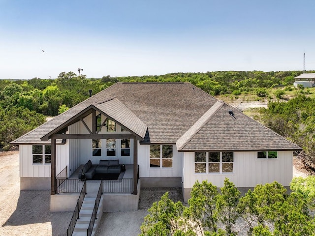 347 Stars And Stripes, Fischer, TX 78623 - back of house with a shingled roof, outdoor lounge area, and a patio area
