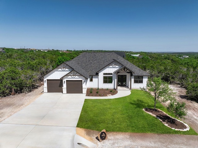 347 Stars And Stripes, Fischer, TX 78623 - modern farmhouse style home with driveway, an attached garage, a front lawn, board and batten siding, and a shingled roof