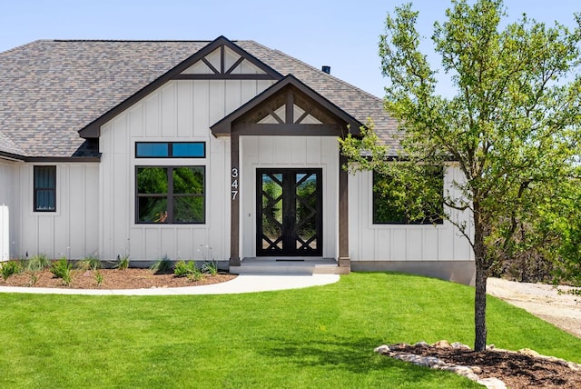 347 Stars And Stripes, Fischer, TX 78623 - view of front facade featuring roof with shingles, board and batten siding, and a front lawn