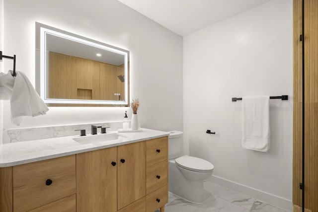 5406 Emerald Forest Dr, Austin, TX 78745 - full bath featuring toilet, baseboards, marble finish floor, and vanity